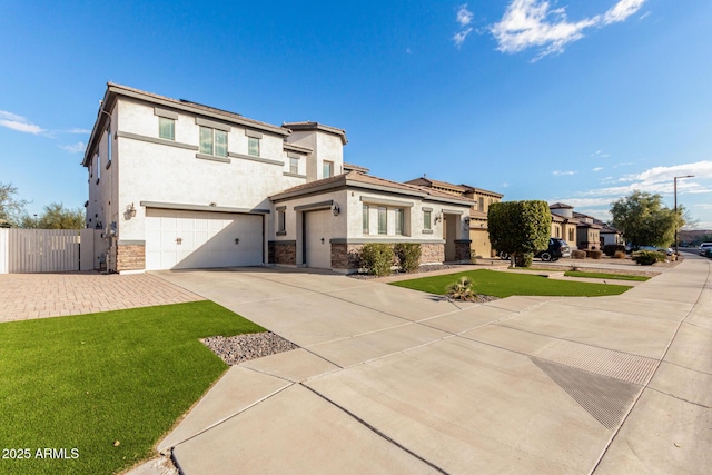 view of front of home with a garage and a front lawn