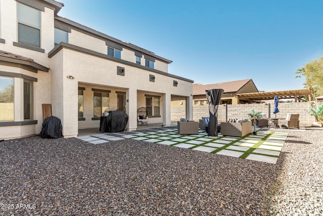 back of house with a patio area and outdoor lounge area