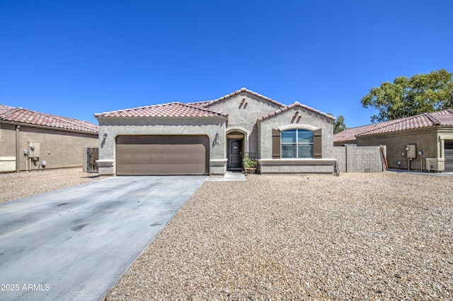 10856 E Primrose Ct, Florence, AZ 85132 - mediterranean / spanish home with an attached garage, concrete driveway, stucco siding, and a tile roof