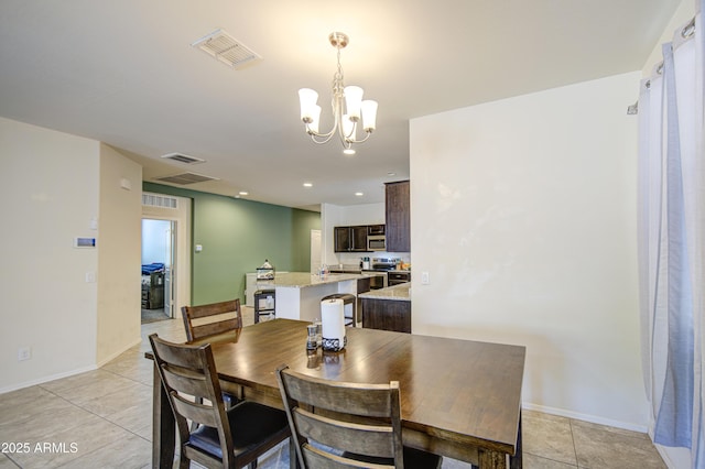 10856 E Primrose Ct, Florence, AZ 85132 - dining room with baseboards, light tile patterned floors, a notable chandelier, and visible vents