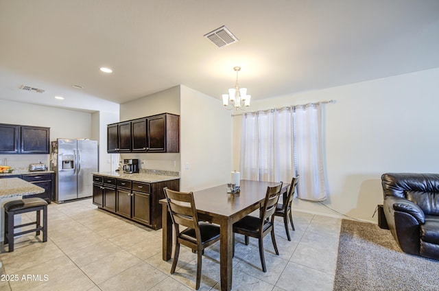 10856 E Primrose Ct, Florence, AZ 85132 - dining room with light tile patterned floors, a notable chandelier, visible vents, and recessed lighting