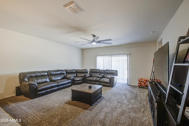 10856 E Primrose Ct, Florence, AZ 85132 - carpeted living area with visible vents, baseboards, and ceiling fan