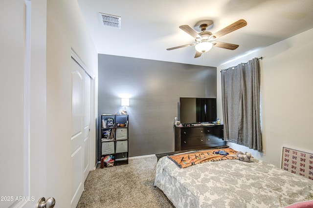 10856 E Primrose Ct, Florence, AZ 85132 - carpeted bedroom with baseboards, visible vents, a closet, and a ceiling fan