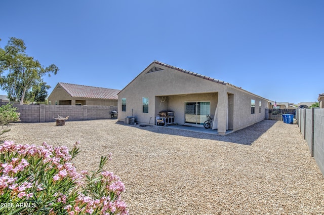 10856 E Primrose Ct, Florence, AZ 85132 - back of property featuring cooling unit, a patio, a fenced backyard, and stucco siding