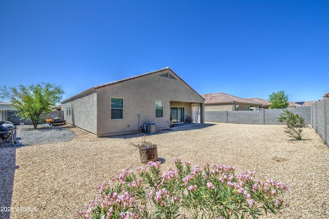 10856 E Primrose Ct, Florence, AZ 85132 - back of house featuring a patio area, a fenced backyard, cooling unit, and stucco siding