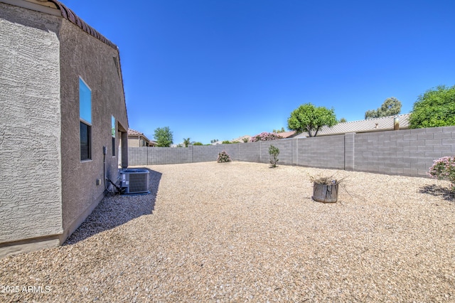 10856 E Primrose Ct, Florence, AZ 85132 - view of yard with a fenced backyard and cooling unit