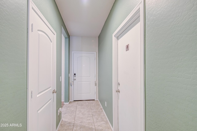 10856 E Primrose Ct, Florence, AZ 85132 - corridor featuring light tile patterned floors and a textured wall