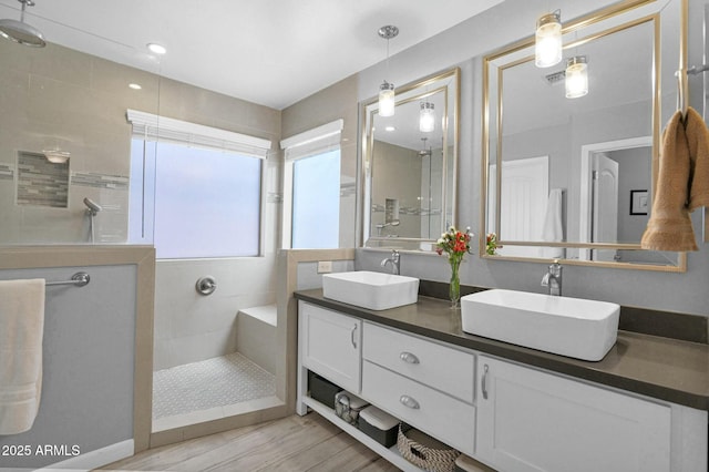 15391 W Yucatan Dr, Surprise, AZ 85379 - bathroom with walk in shower, wood finished floors, and double vanity
