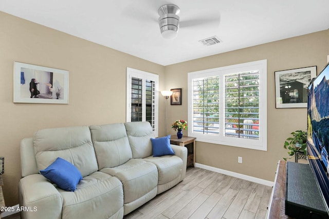 15391 W Yucatan Dr, Surprise, AZ 85379 - living area featuring light wood-style floors and baseboards