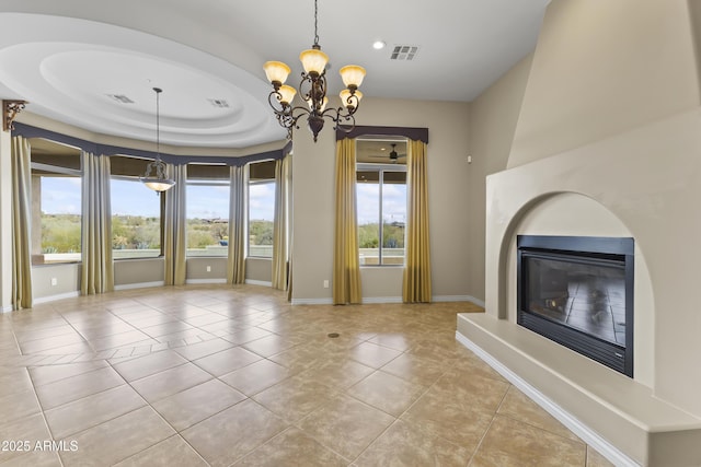 unfurnished living room with light tile patterned flooring and an inviting chandelier