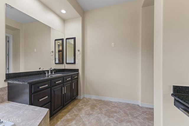 bathroom with tile patterned floors and vanity