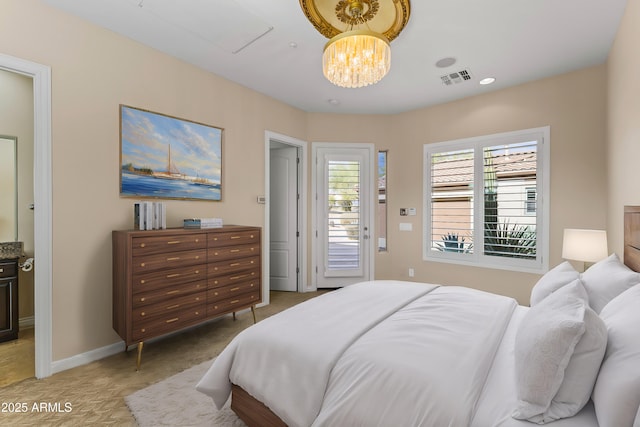 bedroom featuring an inviting chandelier