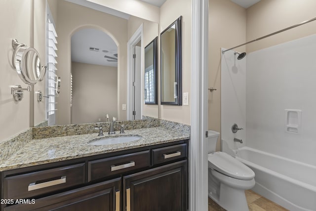 full bathroom featuring vanity, shower / bathtub combination, and toilet