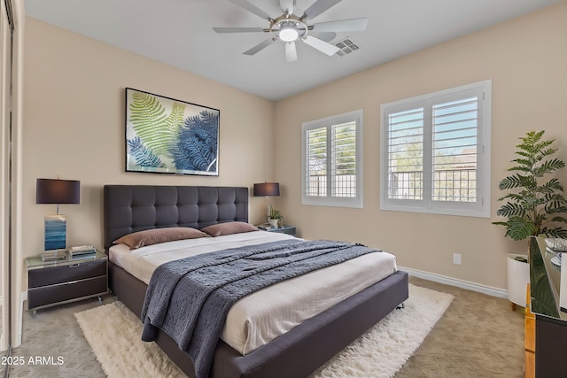 carpeted bedroom with ceiling fan