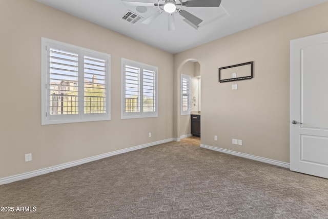 empty room with light carpet and ceiling fan