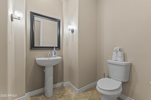 bathroom with tile patterned floors and toilet