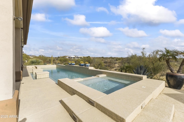 view of pool with an in ground hot tub