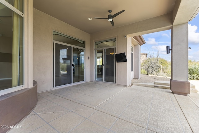 view of patio featuring ceiling fan