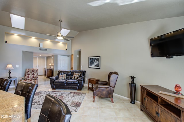 tiled living room with lofted ceiling and ceiling fan