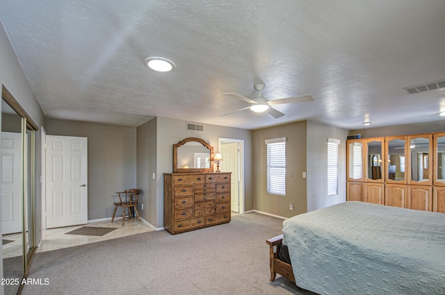 carpeted bedroom with a textured ceiling