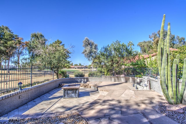 view of patio with an outdoor fire pit