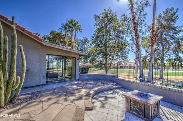 view of patio / terrace featuring a fire pit