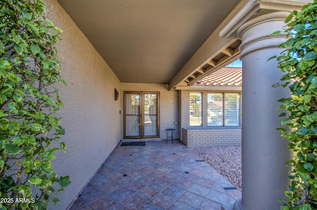 doorway to property with a patio area