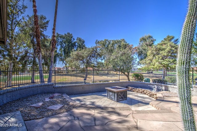 view of patio / terrace featuring an outdoor fire pit