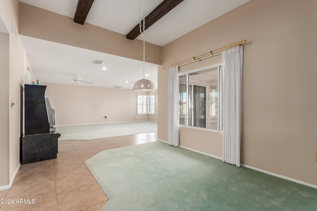 unfurnished living room featuring beamed ceiling, tile patterned flooring, and ceiling fan