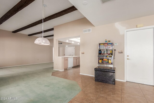 interior space with beamed ceiling and light colored carpet