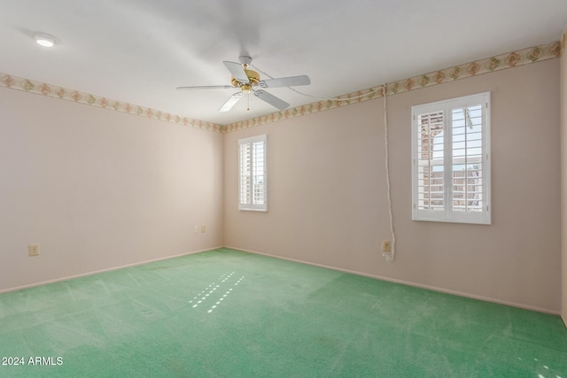 carpeted empty room with ceiling fan