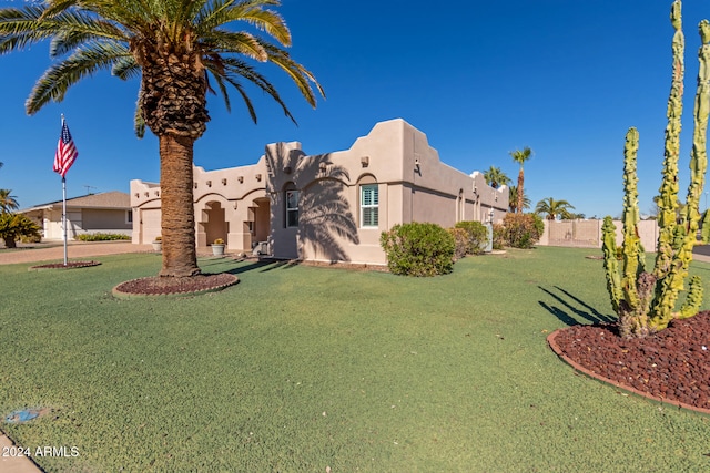 view of front of home with a front lawn