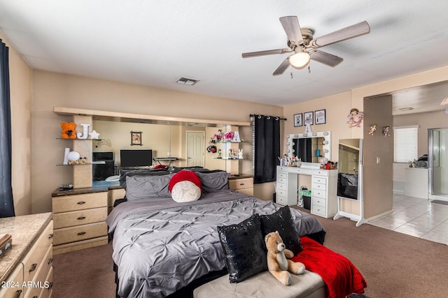 bedroom with light colored carpet and ceiling fan