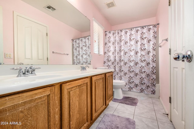 full bathroom featuring shower / tub combo, vanity, toilet, and tile patterned flooring