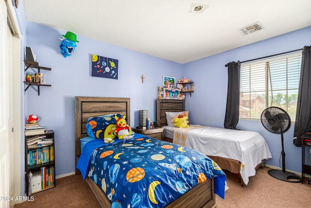 bedroom featuring carpet