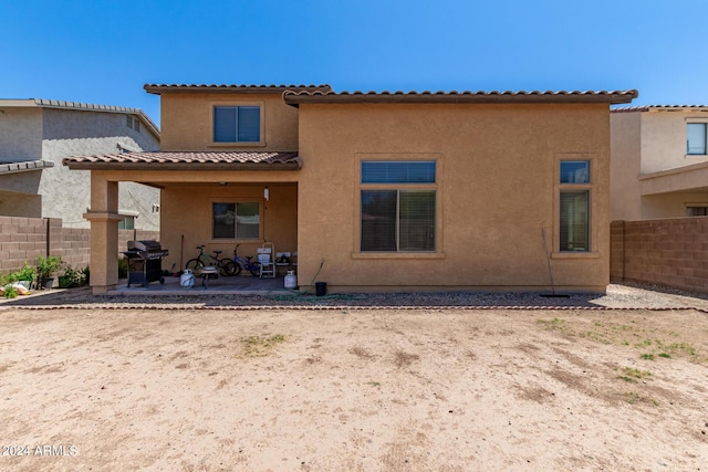 rear view of property with a patio area