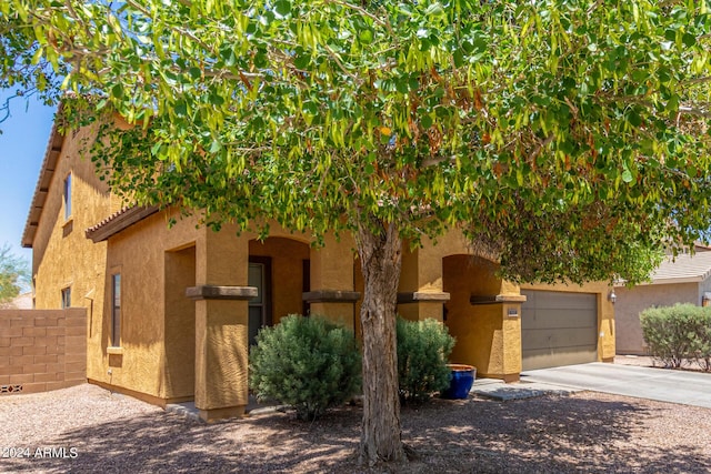 obstructed view of property with a garage