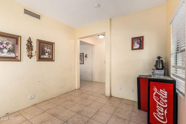 hallway featuring light tile patterned flooring