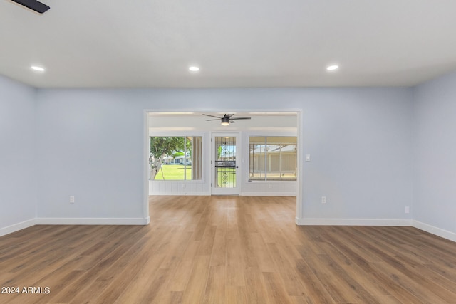 spare room featuring hardwood / wood-style floors and ceiling fan