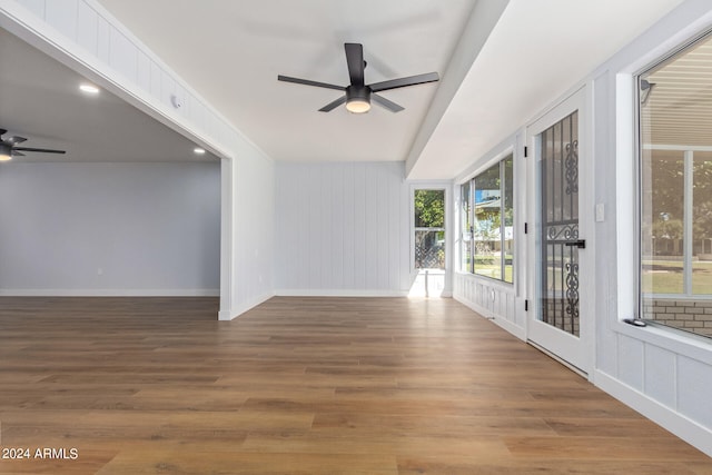 spare room with ceiling fan and hardwood / wood-style flooring