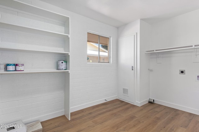 laundry room featuring dark hardwood / wood-style flooring and hookup for an electric dryer