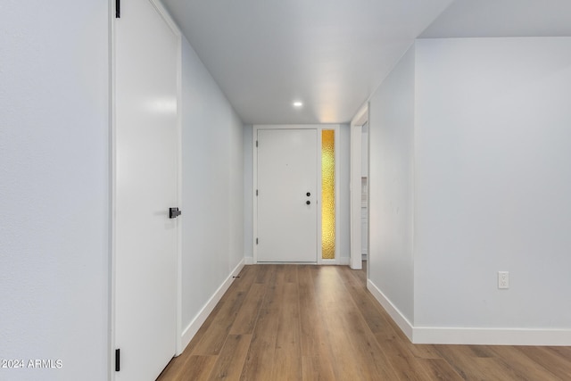 hall with light hardwood / wood-style flooring