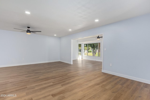 empty room with ceiling fan and wood-type flooring