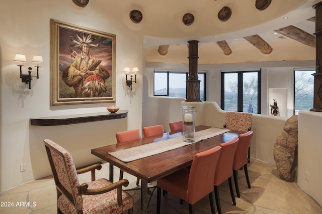 dining area with beamed ceiling