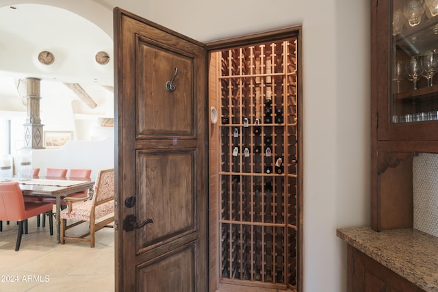 wine room with light tile patterned floors