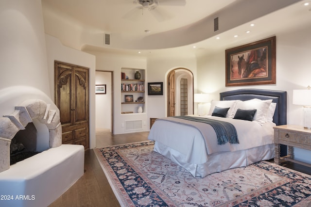 bedroom featuring ceiling fan and dark hardwood / wood-style flooring