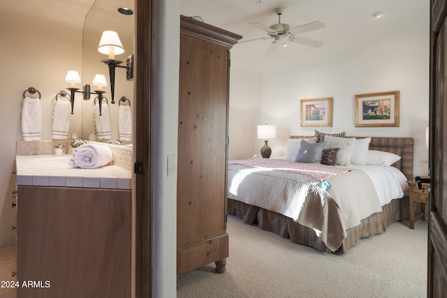 bedroom featuring ceiling fan and light colored carpet