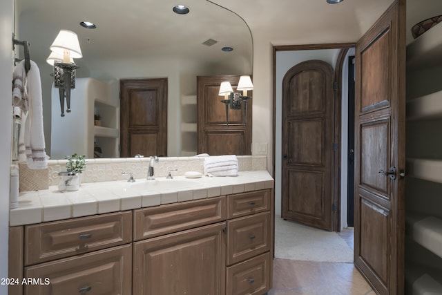 bathroom with vanity and tile patterned floors