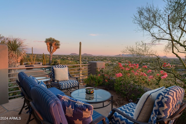 view of patio terrace at dusk