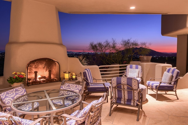 view of patio terrace at dusk